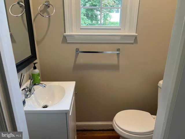 a bedroom with bed and night stand