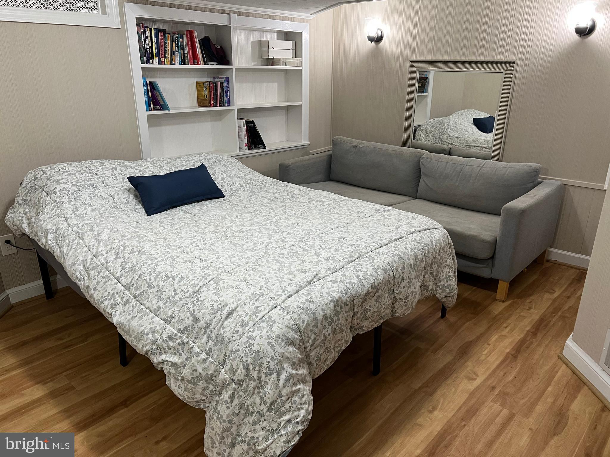 405 Gilmoure Drive Silver Spring, MD 20901 - Photo 28 of 53 a bedroom with bed and night stand