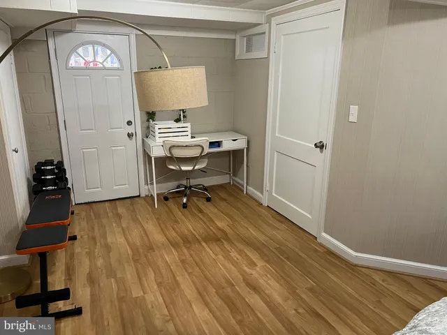a bedroom that has a bed and a desk in it