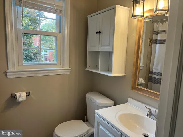 a bathroom with a tub and a shower