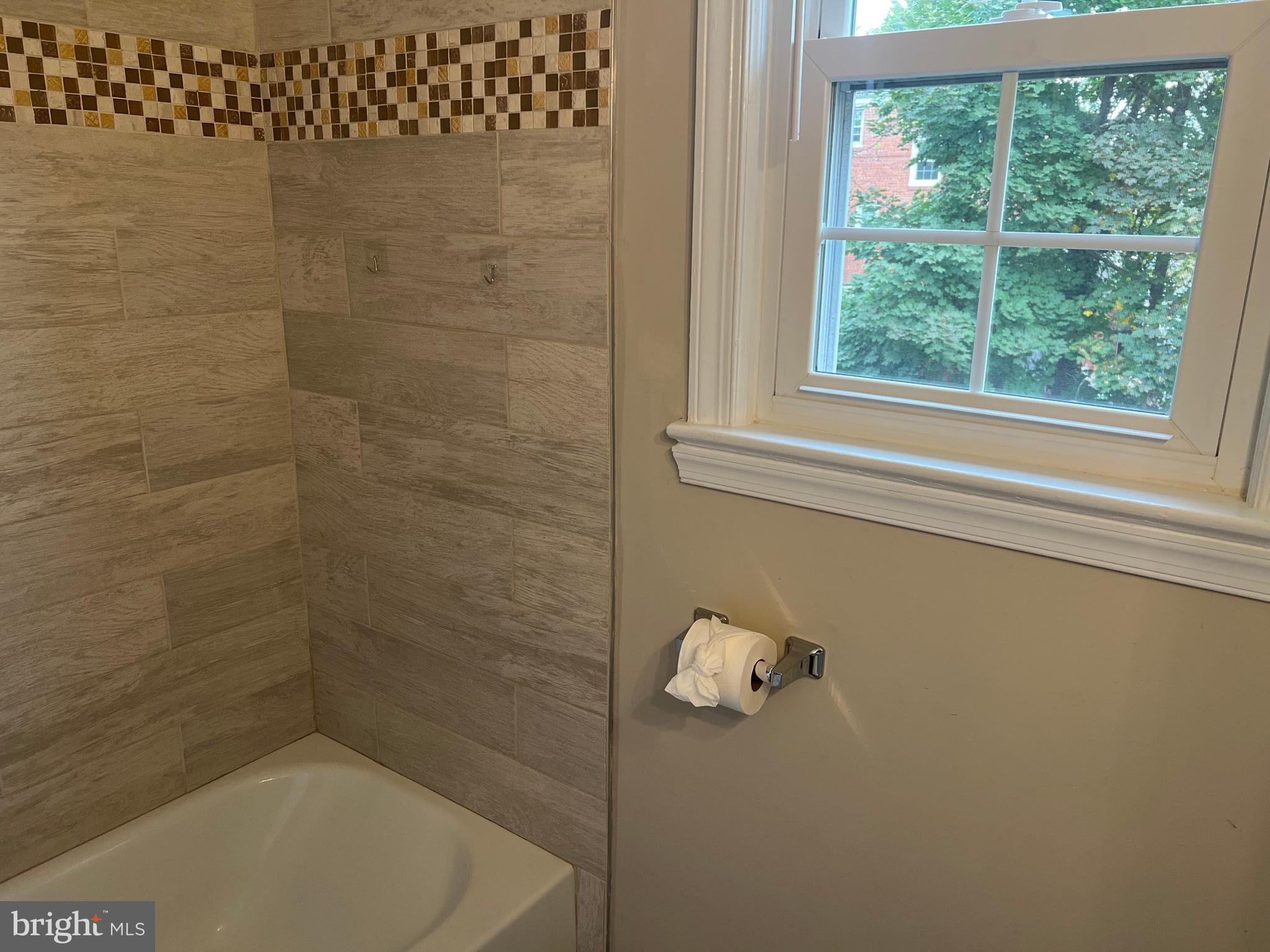 405 Gilmoure Drive Silver Spring, MD 20901 - Photo 37 of 53 a bathroom with a shower