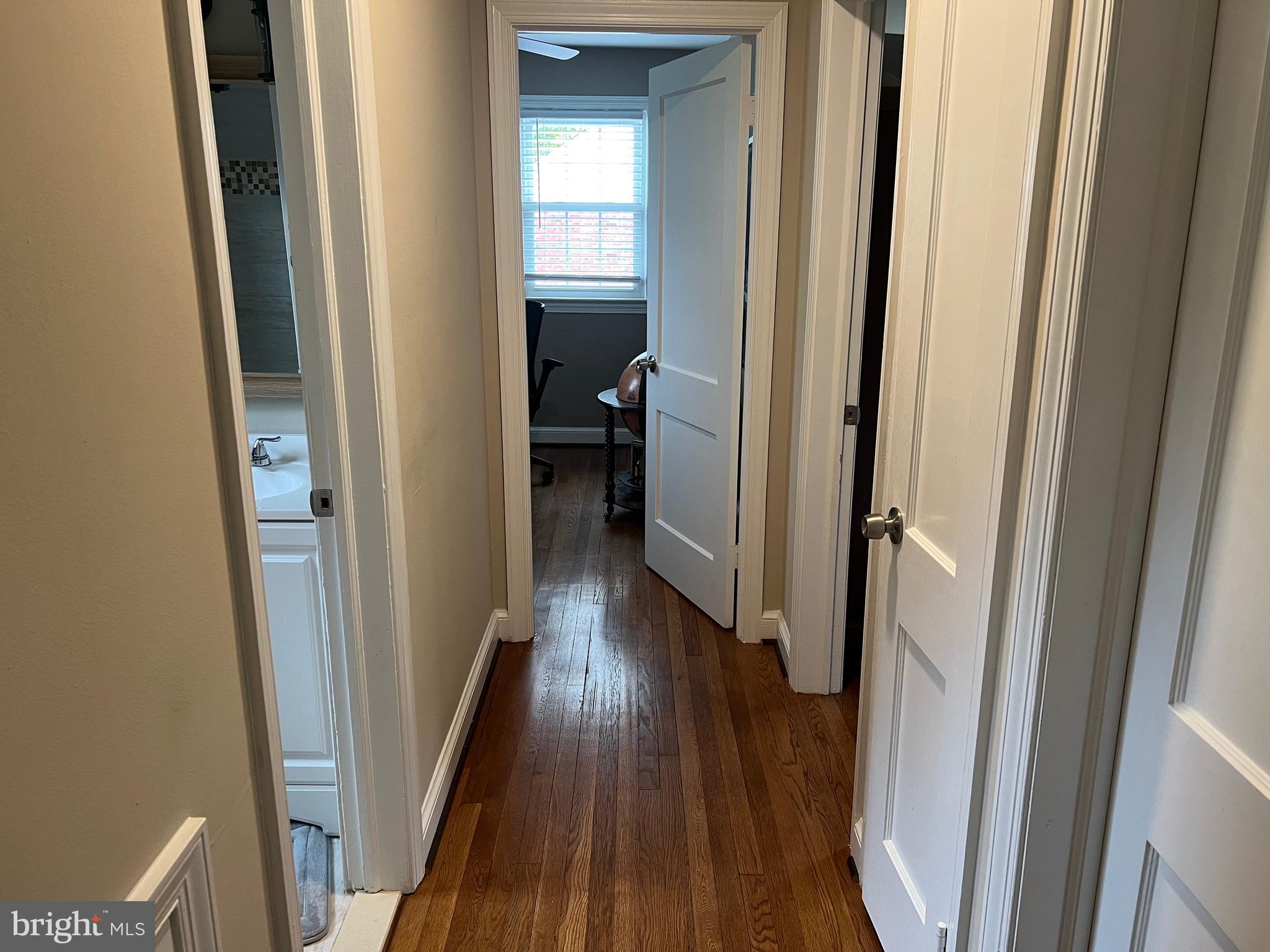 405 Gilmoure Drive Silver Spring, MD 20901 - Photo 38 of 53 a view of a hallway with wooden floor and closet