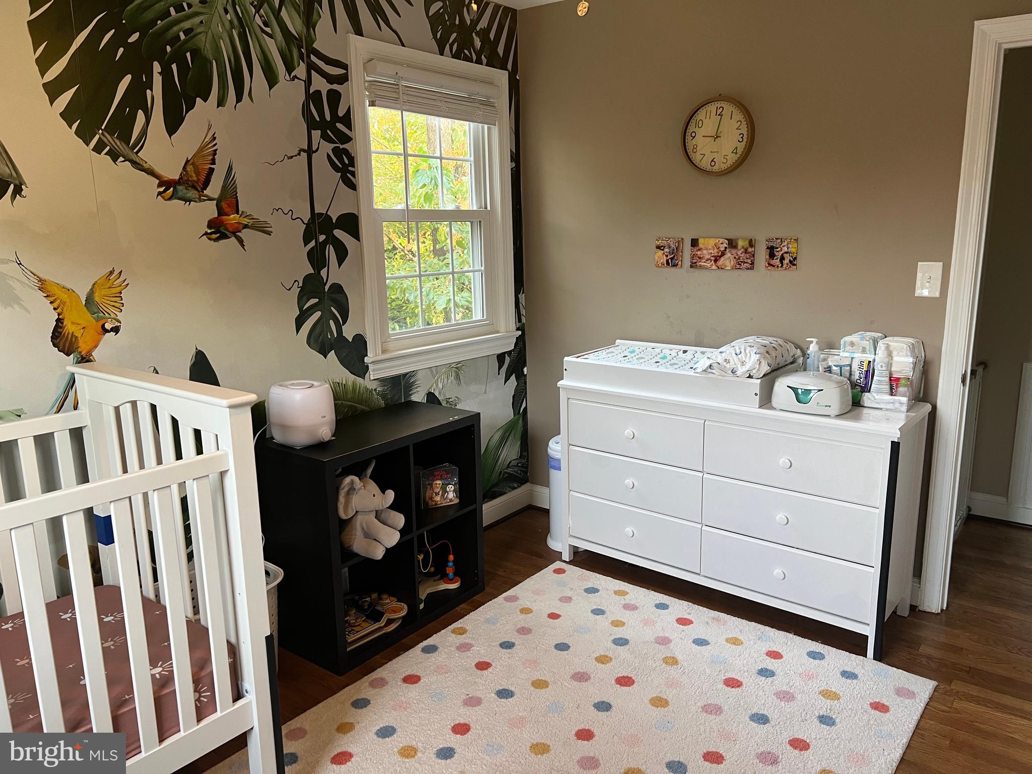 405 Gilmoure Drive Silver Spring, MD 20901 - Photo 43 of 53 a room with a baby crib and a dresser