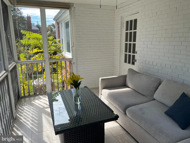 a view of balcony with furniture