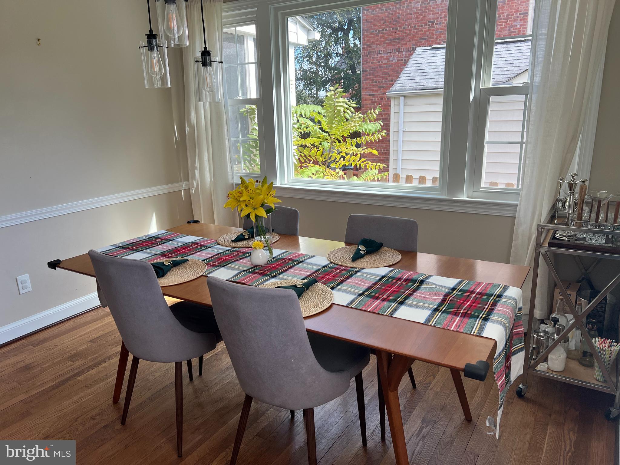 405 Gilmoure Drive Silver Spring, MD 20901 - Photo 10 of 53 a view of a dining room with furniture and wooden floor