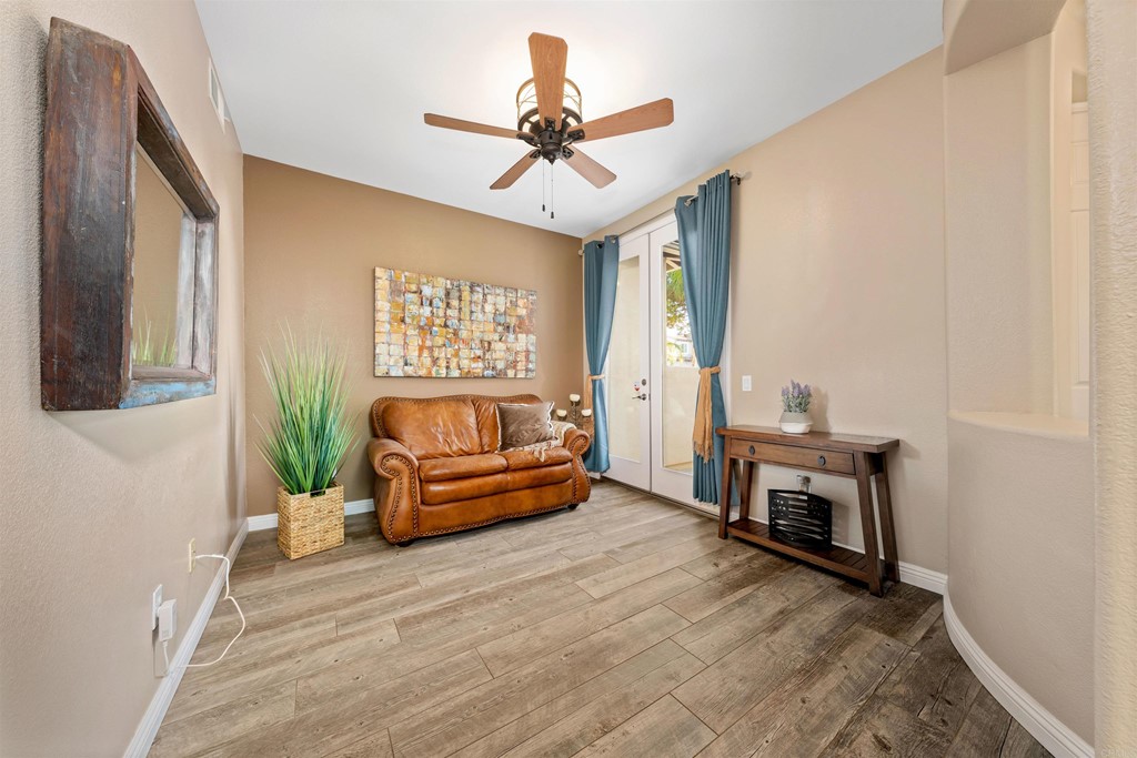 2781 Rambling Vista Road Chula Vista, CA 91915 - Photo 5 of 39 a living room with furniture and a wooden floor