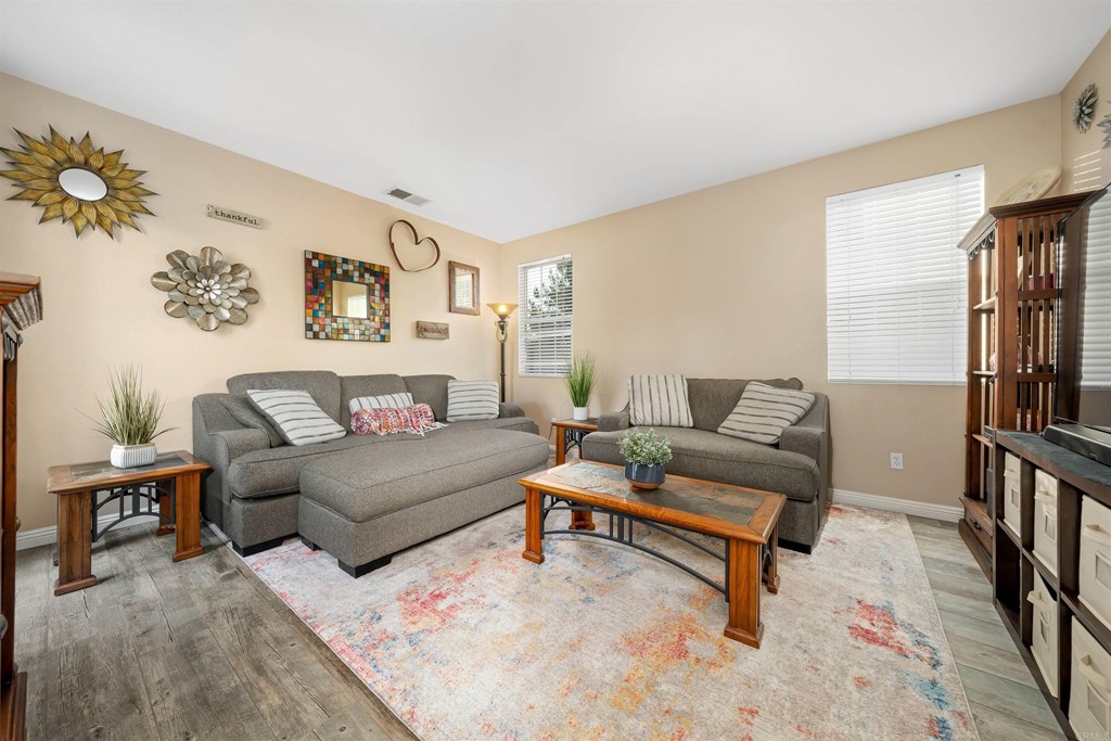 2781 Rambling Vista Road Chula Vista, CA 91915 - Photo 6 of 39 a living room with furniture and a rug