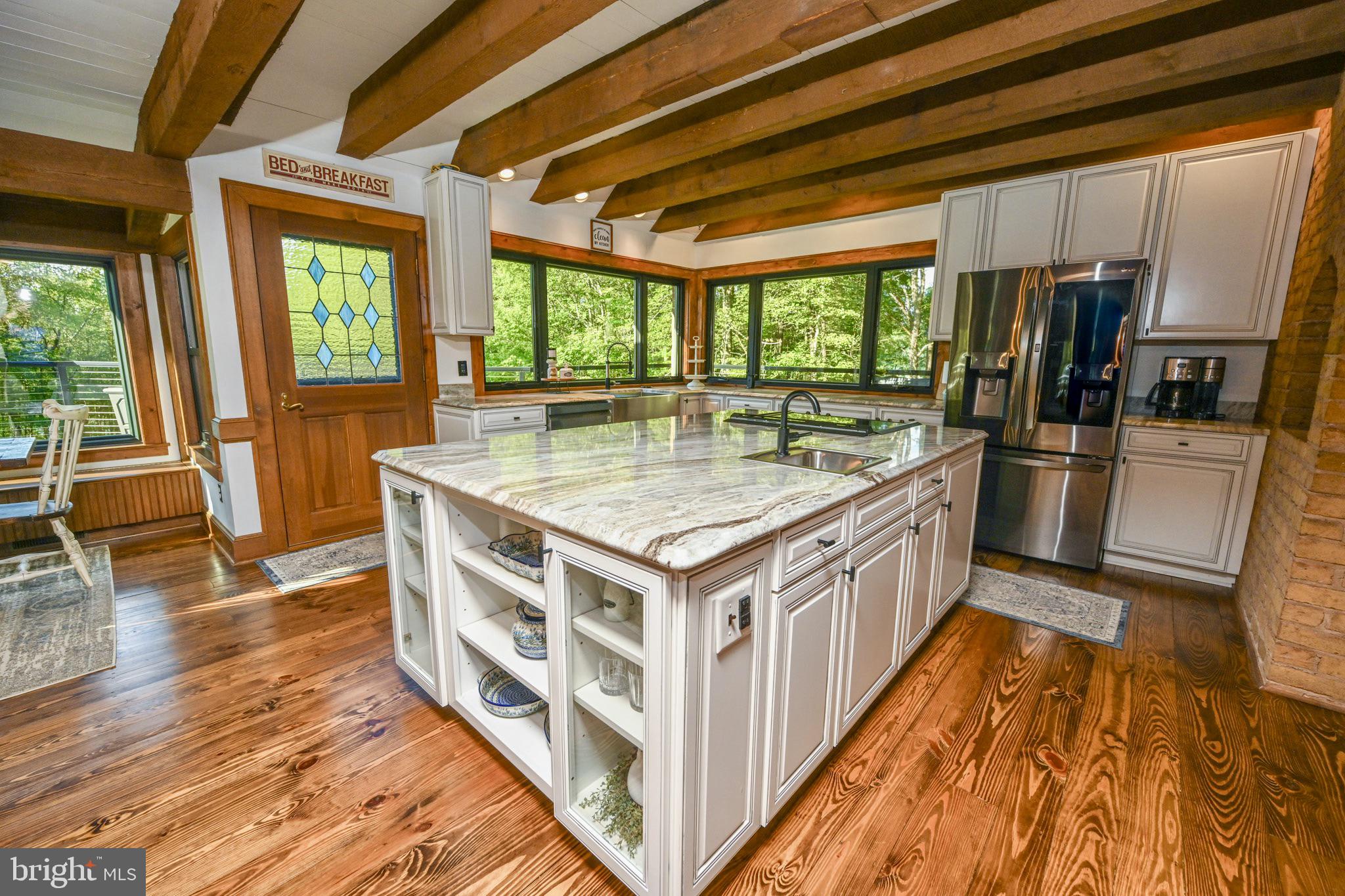 1087 Pergin Farm Road Oakland, MD 21550 - Photo 26 of 149 Beautifully remodeled kitchen surrounded by glass.