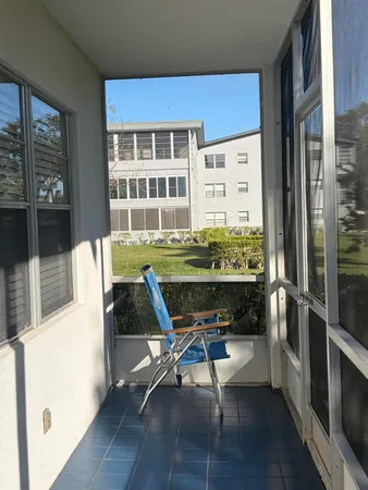 a workspace with furniture window and wooden floor