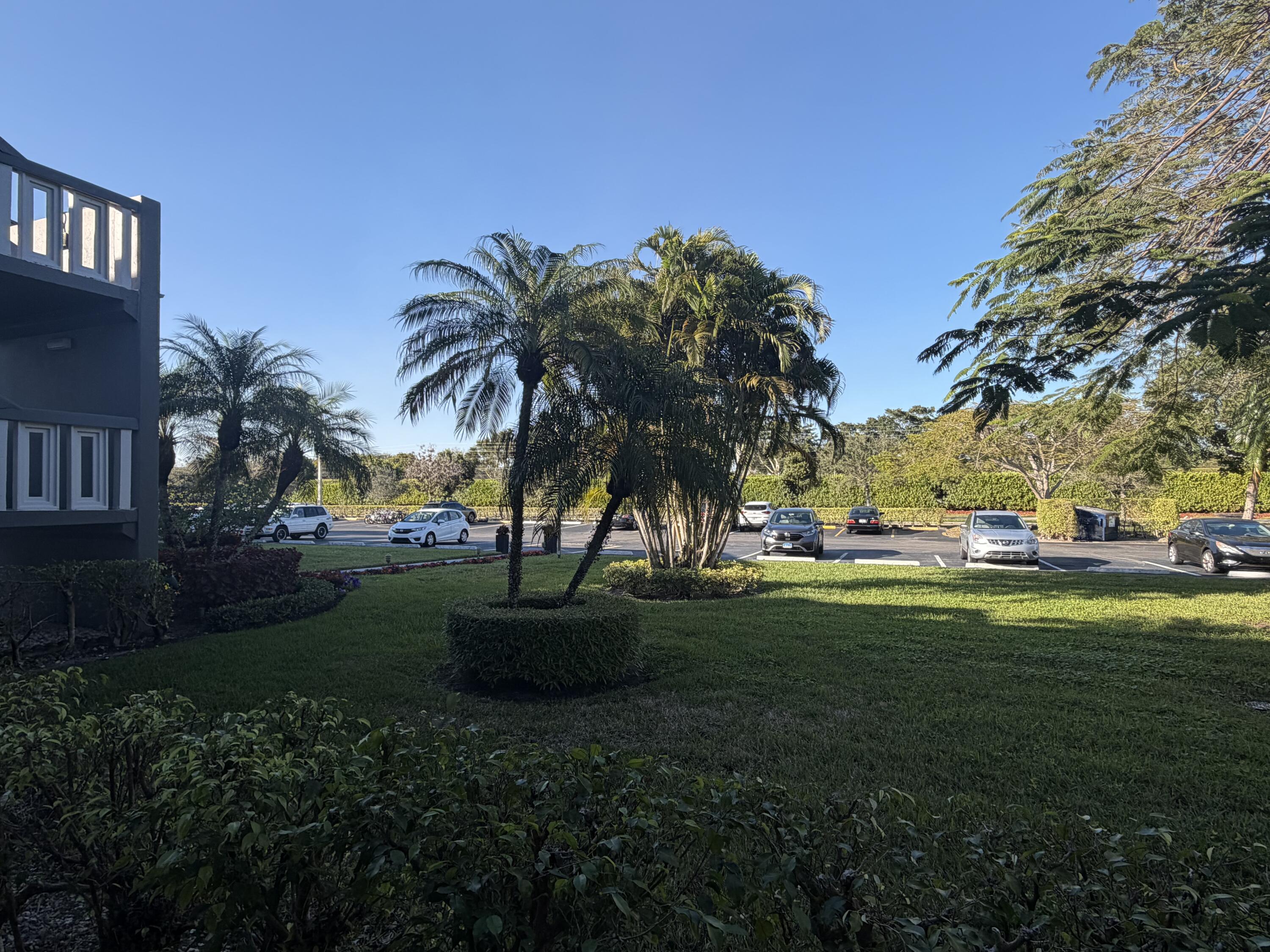 169 Suffolk F Boca Raton, FL 33434 - Photo 14 of 14 a view of a park and trees