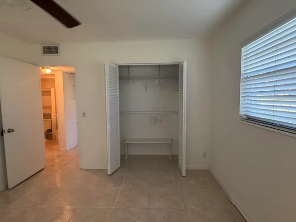 an empty room with closet