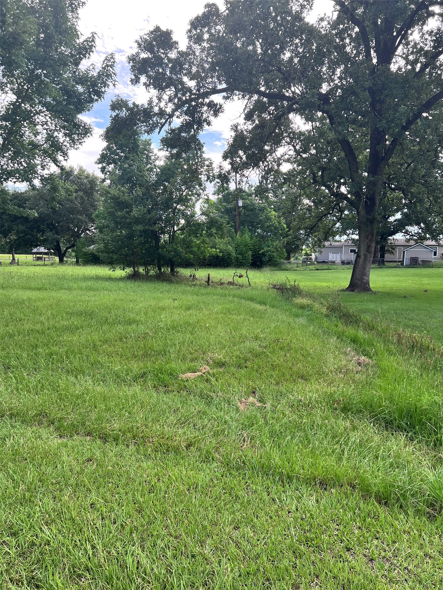 Tbd Monticello Street Trinity, TX 75862 - Photo 2 of 9 a view of field with trees in the background