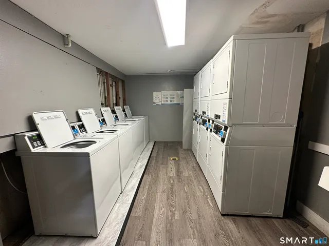 a hallway with washer and dryer