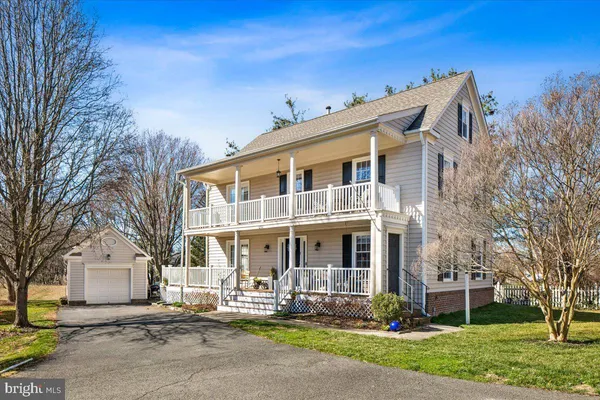 a front view of a building with garden