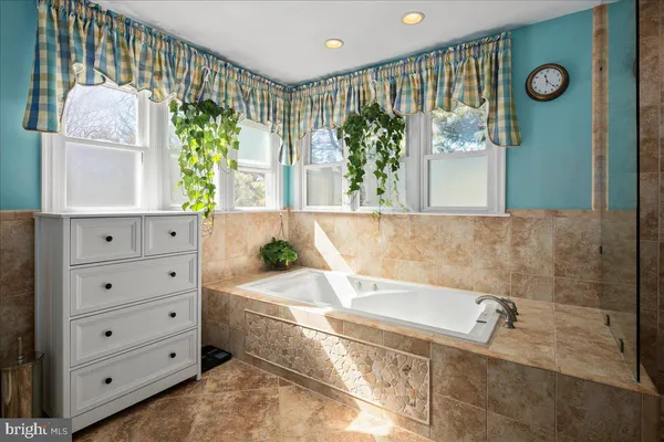 a view of a workspace with furniture and wooden floor