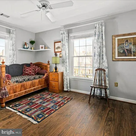a bathroom with a sink toilet and a mirror