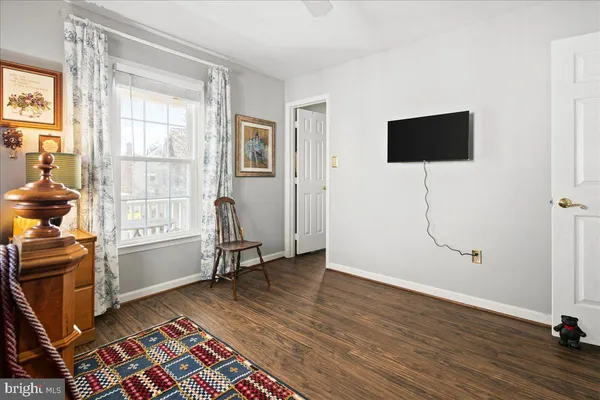 a view of a patio with a table chairs and a fire pit