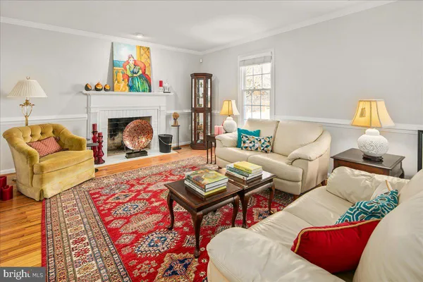 a living room with furniture and a rug