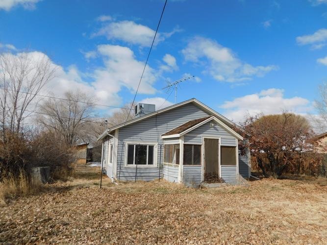 619 35 Road Clifton, CO 81520 - Photo 1 of 6 a view of a house with a yard