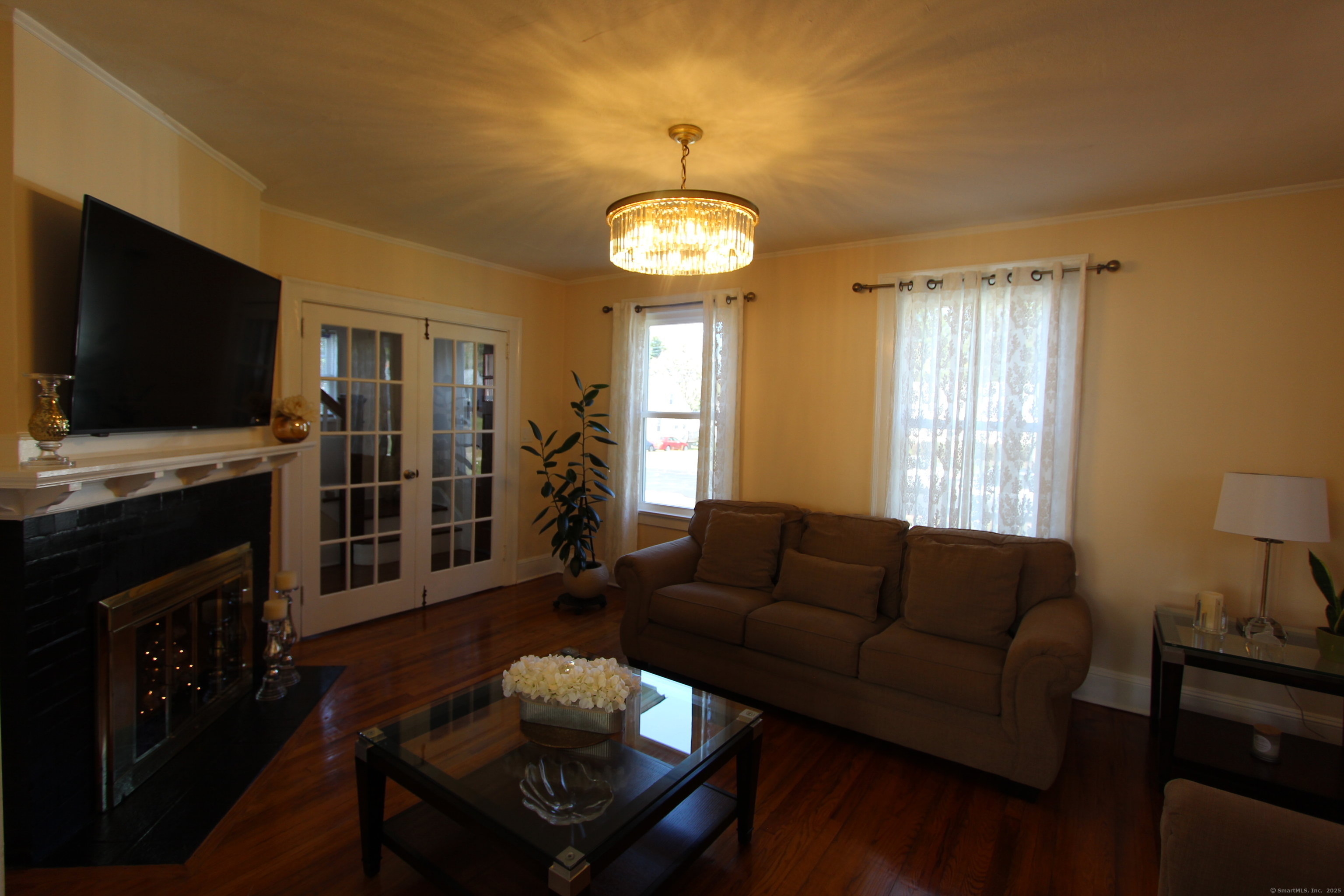 21 Dale Road Wethersfield, CT 06109 - Photo 13 of 25 a living room with furniture and a flat screen tv