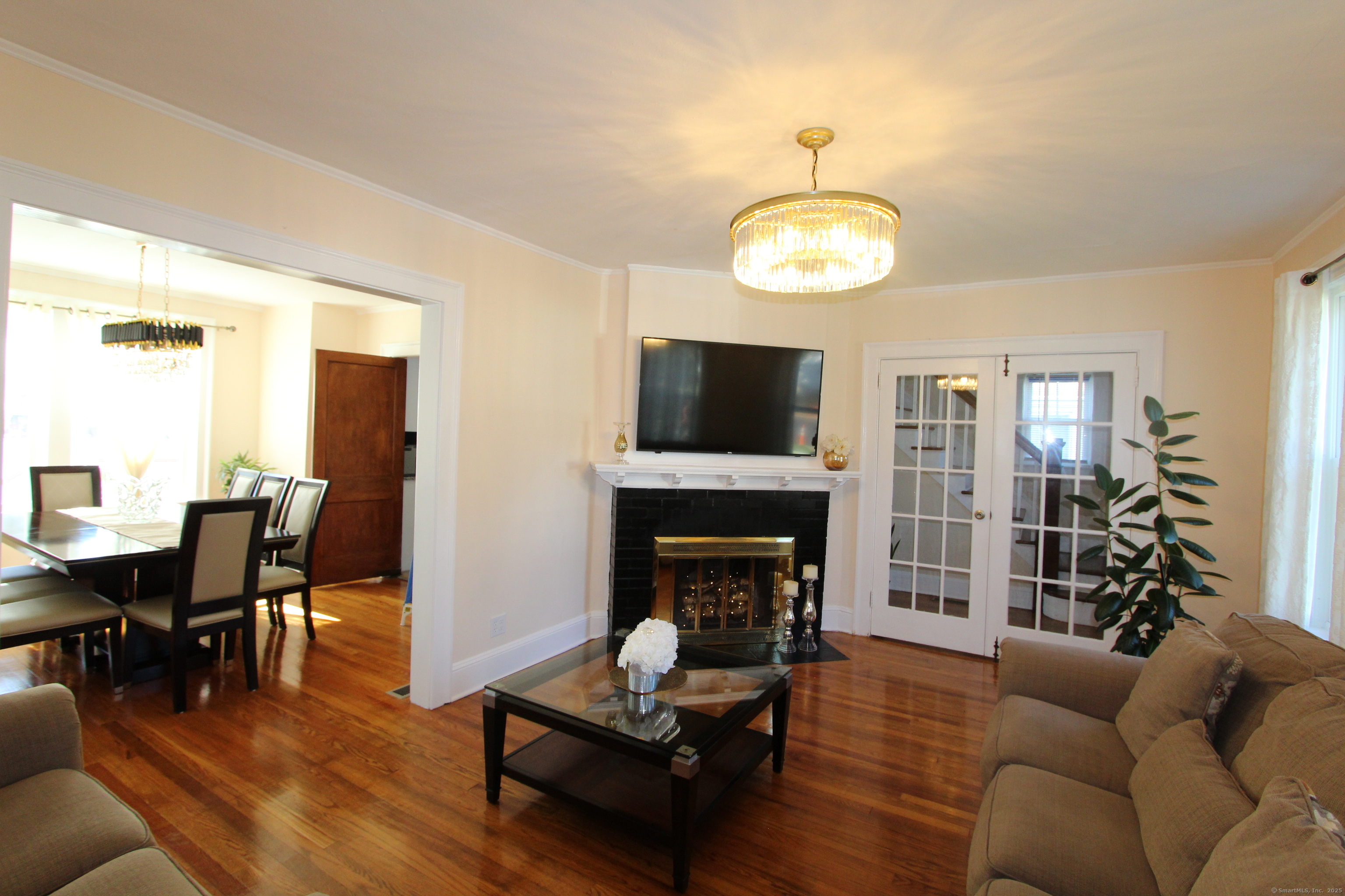 21 Dale Road Wethersfield, CT 06109 - Photo 14 of 25 a living room with furniture flat screen tv and fireplace