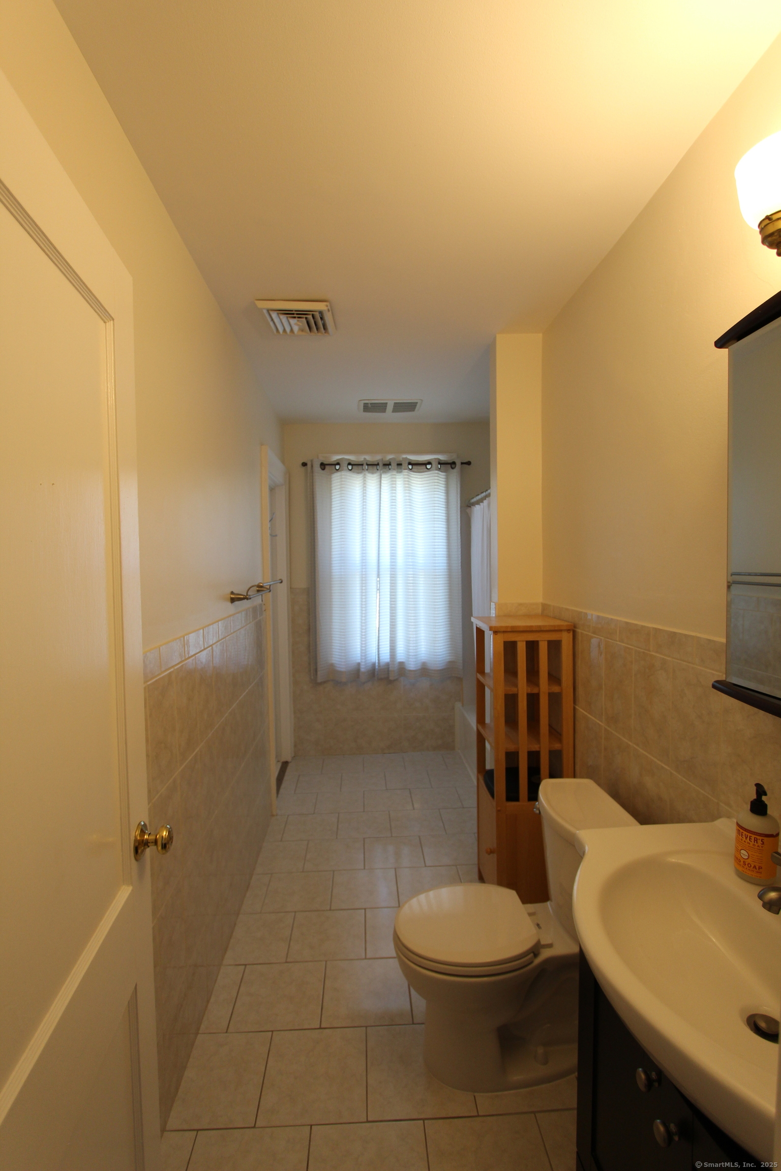 21 Dale Road Wethersfield, CT 06109 - Photo 23 of 25 a bathroom with a sink toilet and shower