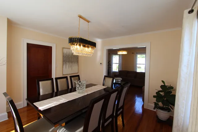 a view of a dining room with furniture and window