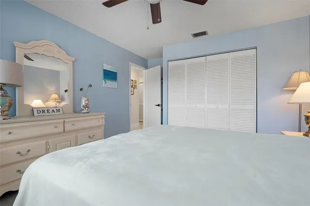 a large white bed in a white room