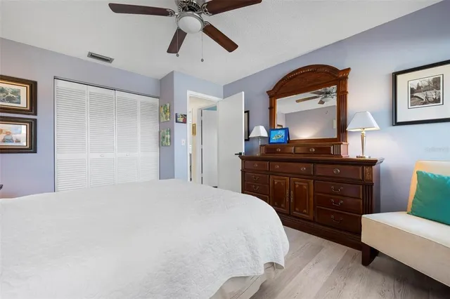 a bedroom with a bed and a dresser