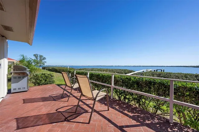 a view of a chairs and table on the terrace