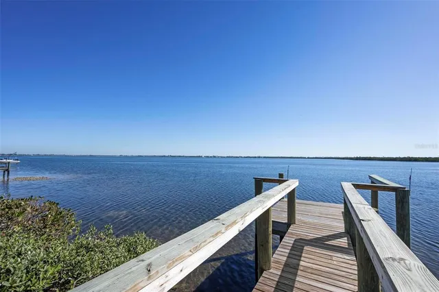 a view of roof deck with wooden floor and seating space