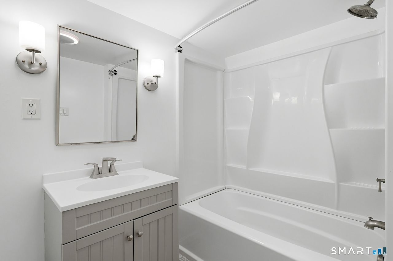206 Gale Avenue Meriden, CT 06450 - Photo 21 of 33 a bathroom with a sink a vanity and a mirror
