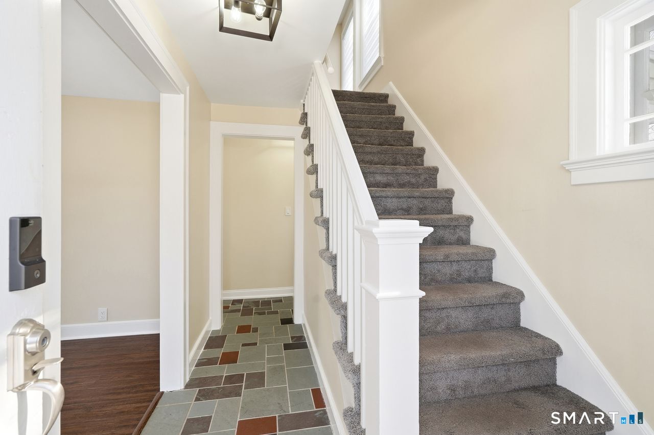 206 Gale Avenue Meriden, CT 06450 - Photo 32 of 33 a view of a hallway with wooden floor and entryway