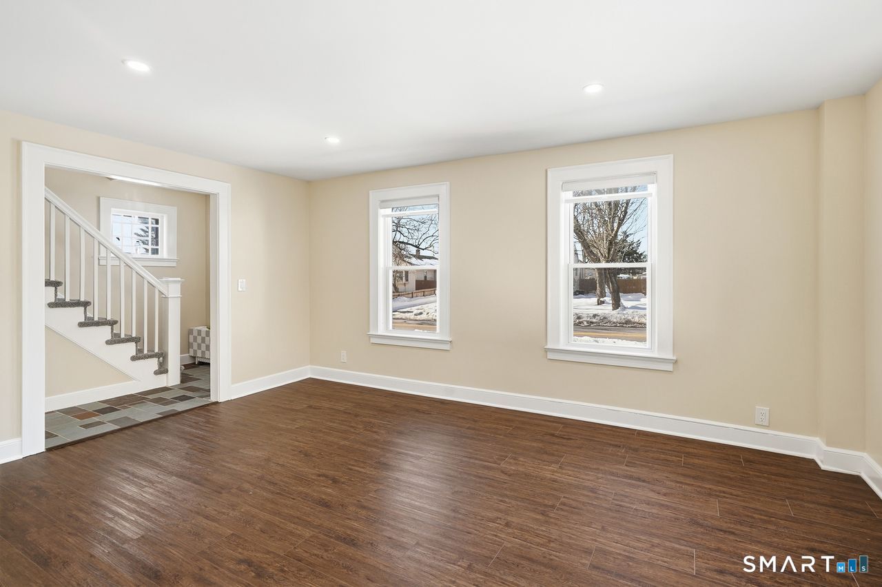 206 Gale Avenue Meriden, CT 06450 - Photo 4 of 33 a view of an empty room with wooden floor and a window