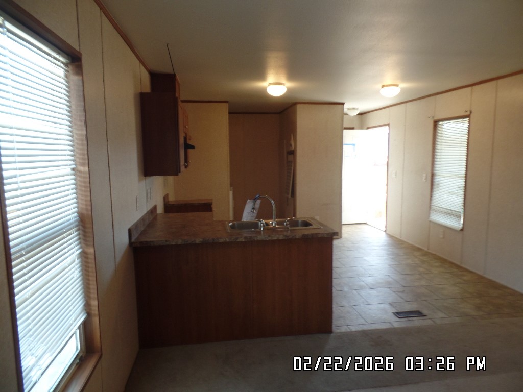 686 Ramar Road Bullhead City, AZ 86442 - Photo 14 of 22 a view of kitchen with stainless steel appliances granite countertop a sink and a refrigerator