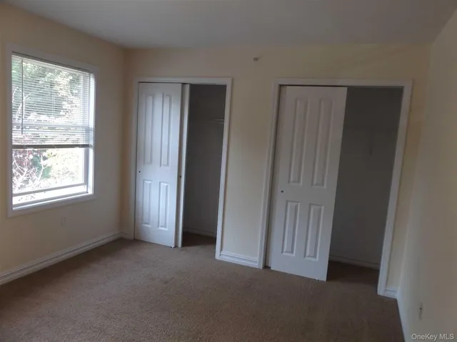 a view of empty room with windows