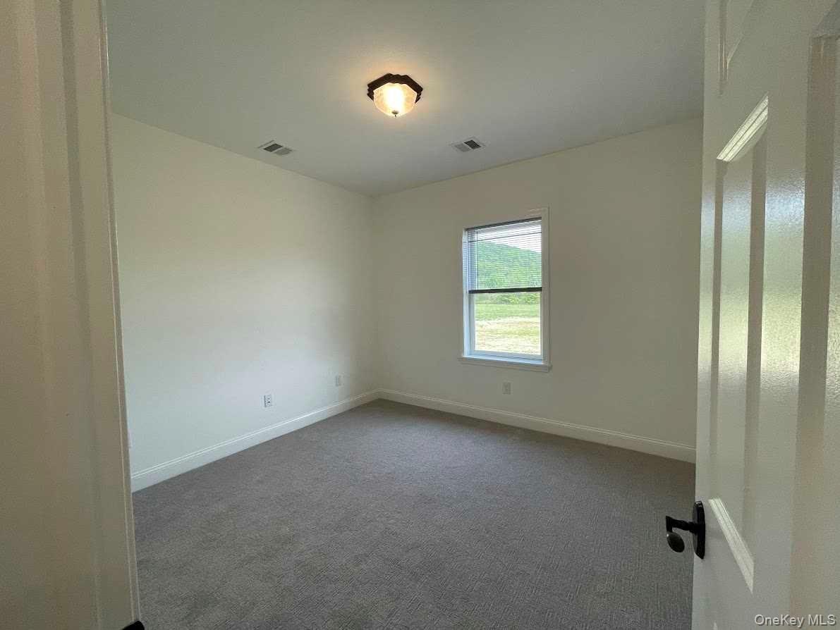 4 State Street, Unit 3 Beacon, NY 12508 - Photo 20 of 20 a view of an empty room with a window