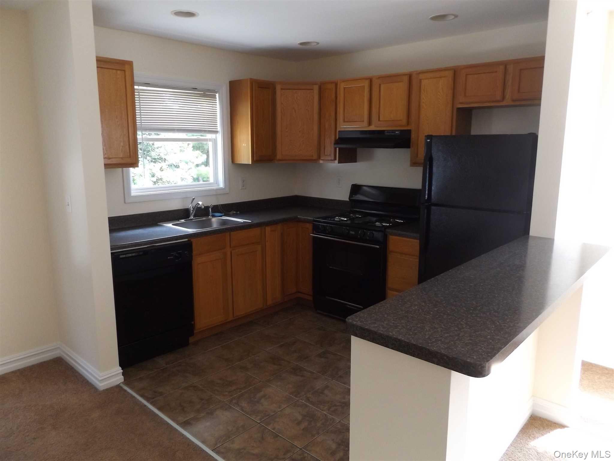 4 State Street, Unit 3 Beacon, NY 12508 - Photo 7 of 20 a kitchen with a sink a stove and refrigerator