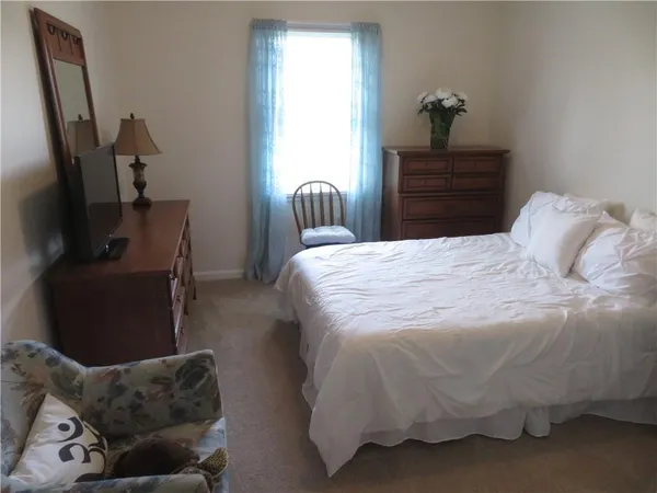 a bedroom with a bed and furniture