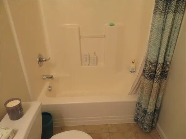 a bathroom with a tub and shower