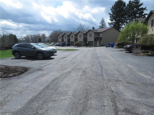 a view of cars parked in front of a building