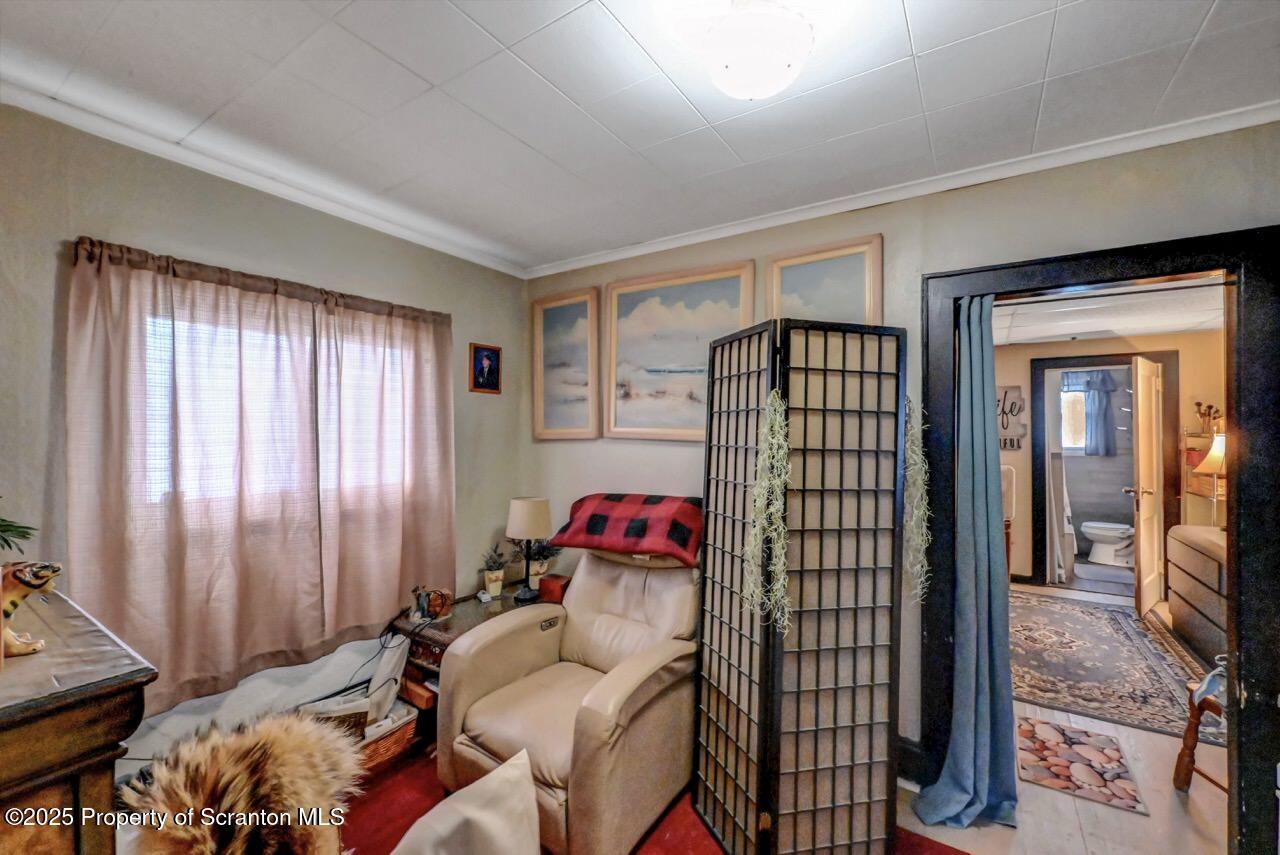 1223 Eynon Street Scranton, PA 18504 - Photo 11 of 42 a living room with furniture and a flat screen tv