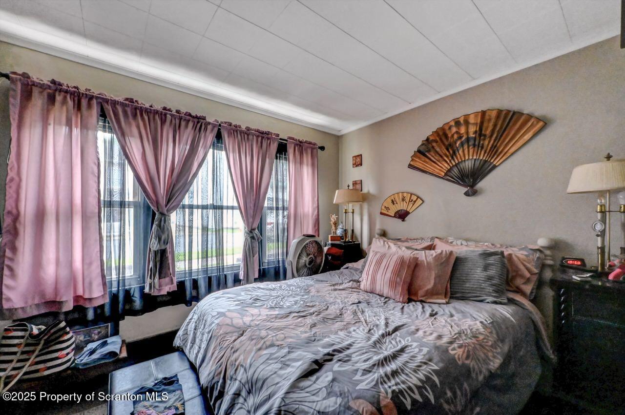 1223 Eynon Street Scranton, PA 18504 - Photo 12 of 42 a bedroom with a bed and a window
