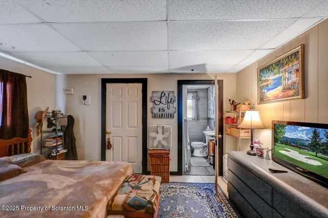 a bedroom with furniture and a window