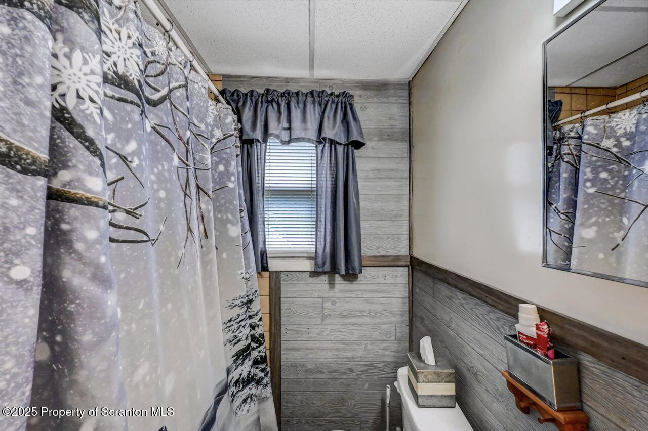 1223 Eynon Street Scranton, PA 18504 - Photo 17 of 42 a view of staircase with wooden floor and wall