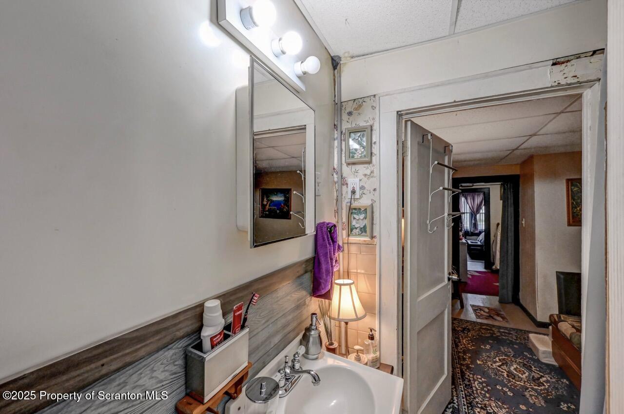 1223 Eynon Street Scranton, PA 18504 - Photo 18 of 42 a living room with furniture and a fireplace