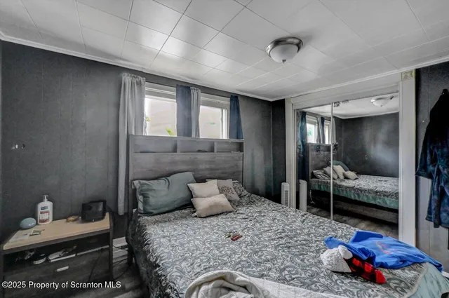 a bedroom with furniture and a window