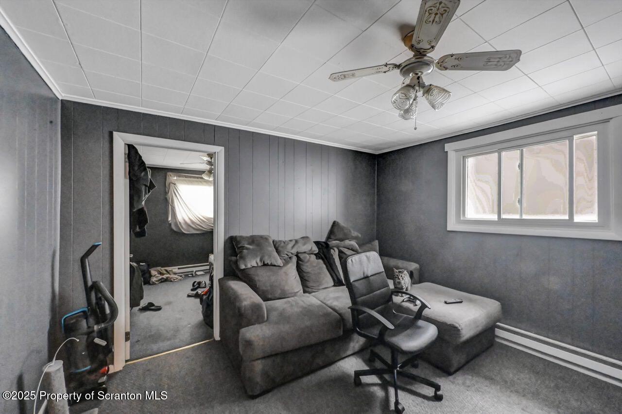 1223 Eynon Street Scranton, PA 18504 - Photo 29 of 42 a living room with furniture and a window