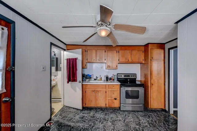 a kitchen with stainless steel appliances granite countertop a stove a refrigerator and a sink