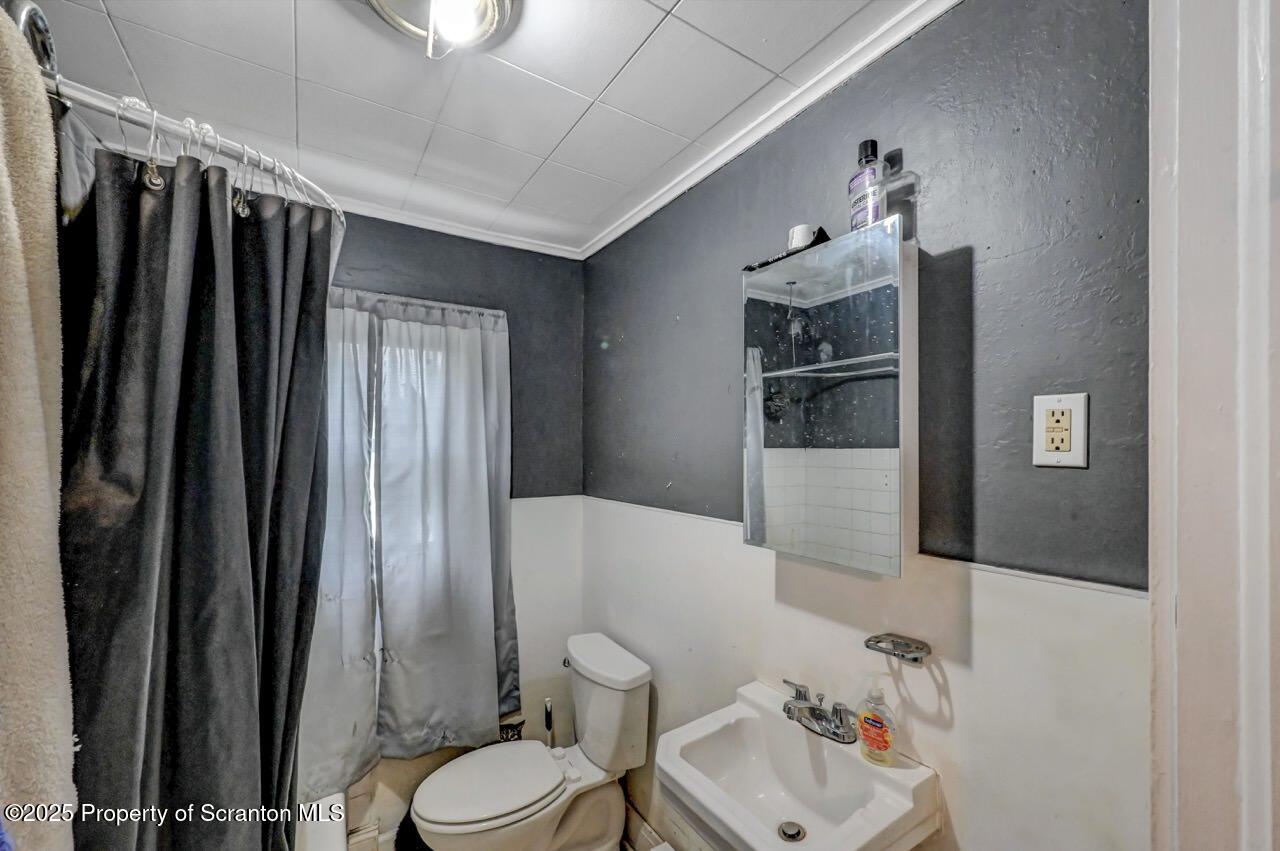 1223 Eynon Street Scranton, PA 18504 - Photo 33 of 42 a bathroom with a sink toilet and shower